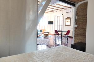 a room with a bed and a table and chairs at Loft el Carmen amazing views in Valencia