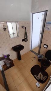 Ванна кімната в Hostel e Cachaçaria da Cris