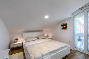 Postel nebo postele na pokoji v ubytování Apartman Krstičević