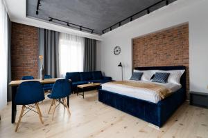Posteľ alebo postele v izbe v ubytovaní Apartament w ścisłym centrum miasta.