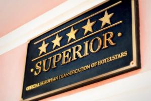 a sign for a supervisor sign on a wall at Carlsbad Plaza Medical Spa & Wellness hotel in Karlovy Vary