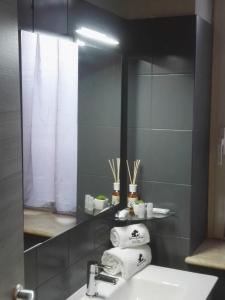 a bathroom with a sink and a mirror at B&B via Piave da Lillo in Frosinone