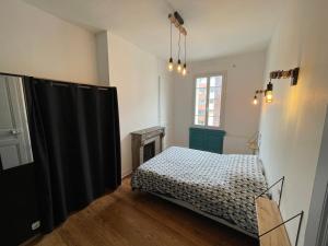 Кровать или кровати в номере Appartement Chic F2 Centre-ville