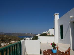 a balcony of a house with a view of the ocean at Melide in Tripití