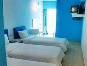 Postel nebo postele na pokoji v ubytování YY38 Hotel