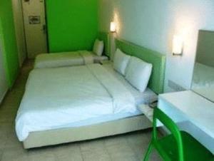 Postel nebo postele na pokoji v ubytování YY38 Hotel