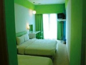 Postel nebo postele na pokoji v ubytování YY38 Hotel