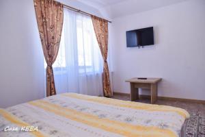 TV a/nebo společenská místnost v ubytování Casa Keea