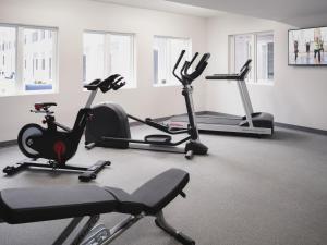 a gym with several exercise bikes and tread machines at stayAPT Suites Greenville-Greer/BMW in Greer