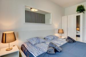 Postelja oz. postelje v sobi nastanitve Platinium Apartment by Blue Baltic Apart