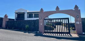 a gate in front of a house at Las Casitas Rusticas in La Asomada