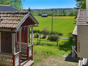 a small house with a view of a field at 7 person holiday home in J RBO in Åshammar