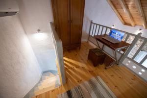 an overhead view of a room with a laptop on a desk at Oneiro Cottage in Skopelos Town