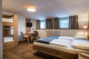 Postel nebo postele na pokoji v ubytování Charme Hotel Uridl + 37 fotografií
