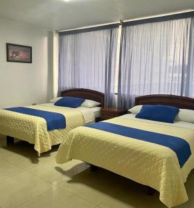 Posteľ alebo postele v izbe v ubytovaní Hotel Del Pacifico
