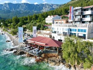 an aerial view of a resort on the water at Guesthouse Villa Paškal in Zaostrog