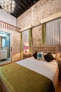 a bedroom with a large bed in a room at Cedrus Hotel in Antalya
