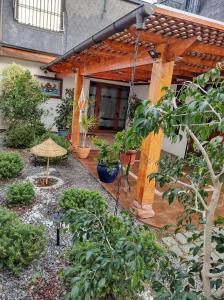 a pergola in the middle of a garden at Los Araucanos in Santiago