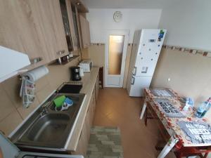 an overhead view of a kitchen with a sink and a refrigerator at ZSE Residence in Constanţa
