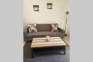 a living room with a couch and a coffee table at Calanques de Sormiou in Marseille