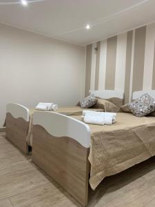 A bed or beds in a room at Case vacanza Sole e Luna