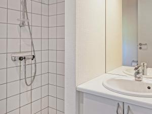 a bathroom with a shower and a sink at 12 person holiday home in Aakirkeby in Vester Sømarken
