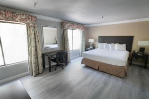 
Postel nebo postele na pokoji v ubytování Alexis Park All Suite Resort
