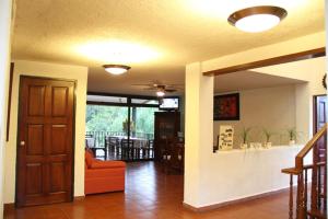 a living room with a couch and a table at Hotel Quinta del Sol in Tepoztlán