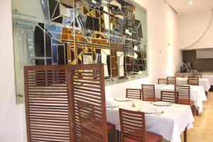 Ein Restaurant oder anderes Speiselokal in der Unterkunft Hotel Scala Magna 