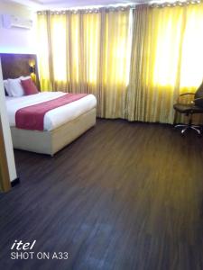 Rúm í herbergi á Citilodge Hotel