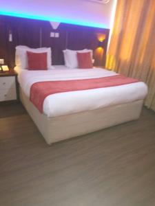 Rúm í herbergi á Citilodge Hotel