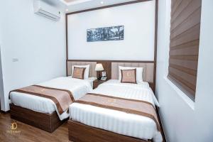 Rúm í herbergi á Trần Đạt Hotel