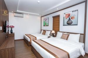 Rúm í herbergi á Trần Đạt Hotel