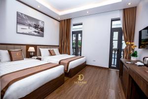 Rúm í herbergi á Trần Đạt Hotel