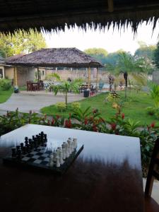 a chess board on a table in front of a yard at Hidden Jewel Resort in Panglao