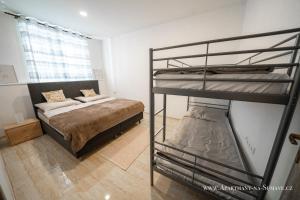 Posteľ alebo postele v izbe v ubytovaní Apartmány na Šumavě