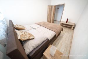 Posteľ alebo postele v izbe v ubytovaní Apartmány na Šumavě