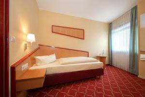 Postel nebo postele na pokoji v ubytování Montana Hotel