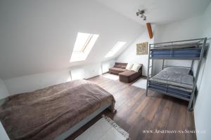 Posteľ alebo postele v izbe v ubytovaní Apartmány na Šumavě