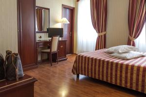 Postel nebo postele na pokoji v ubytování Hotel Benaco Garda ***S