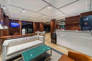 a lobby with a couch and a bar at Marisstone Hotels in Mecidiye