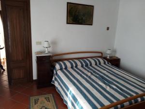 A bed or beds in a room at Casa Vacanze Liperni