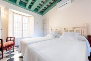 Posteľ alebo postele v izbe v ubytovaní Genteel Home Casa Alcázar