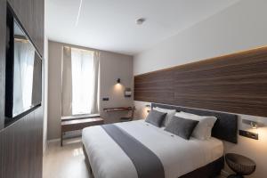 Postel nebo postele na pokoji v ubytování Aiello Hotels - Centrale