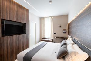 Postel nebo postele na pokoji v ubytování Aiello Hotels - Centrale
