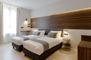 Postel nebo postele na pokoji v ubytování Aiello Hotels - Centrale