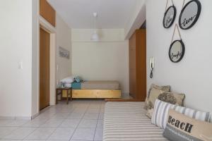 A bed or beds in a room at Homey Studio for 3 ppl in Heraklion City