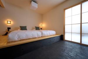 Llit o llits en una habitació de yubune