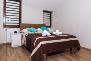 Ένα ή περισσότερα κρεβάτια σε δωμάτιο στο Apartamenty Premium De Lux