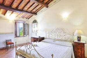 Postel nebo postele na pokoji v ubytování Agriturismo I Fuochi